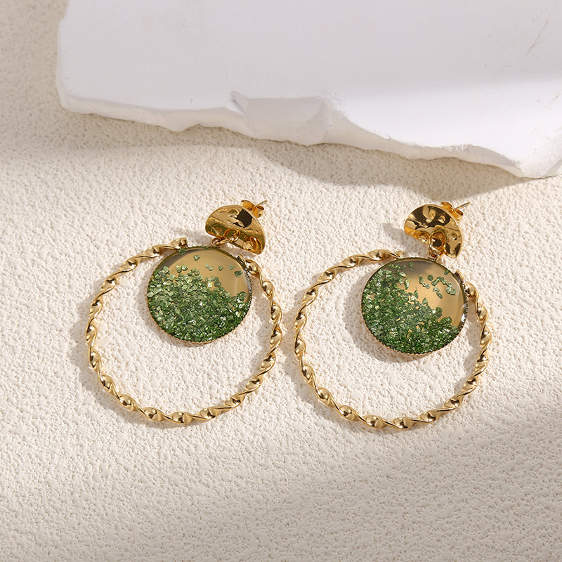 Boucles d'Oreilles Dorées Torsadées Avec Cristaux Vertes Girl's Dream