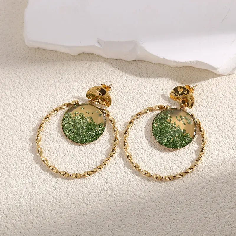 Boucles d'Oreilles Dorées Torsadées Avec Cristaux Vertes Girl's Dream