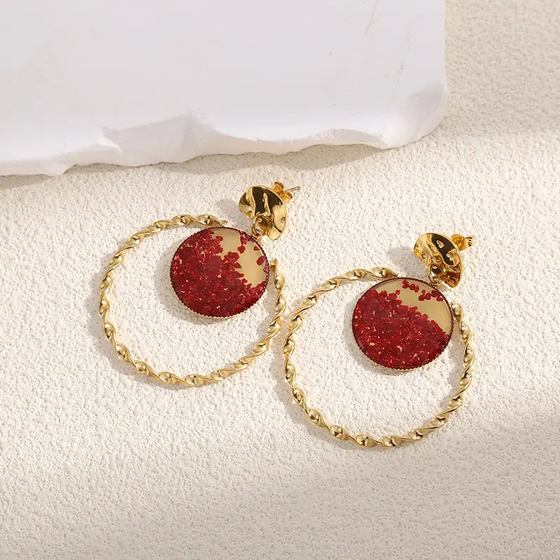 Boucles d'Oreilles Dorées Torsadées Avec Cristaux Rouges Girl's Dream